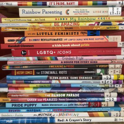 A stack of colorful picture books, spines facing out